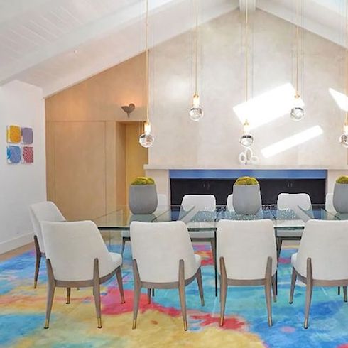 Celebrity homes - White walls and wood floors splashed with pops of colour from the eclectic art and rainbow rugs run throughout comedian and actor Jim Carrey’s former Los Angeles mansion