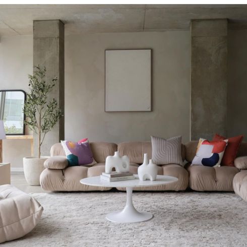 Low-slung cream-coloured sofa