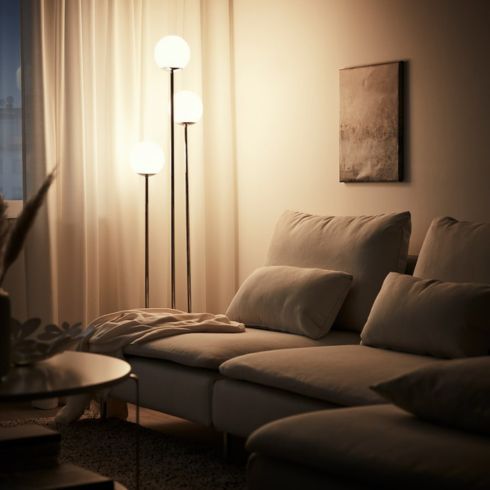 IKEA's Modern Steel Lamp next to a sectional