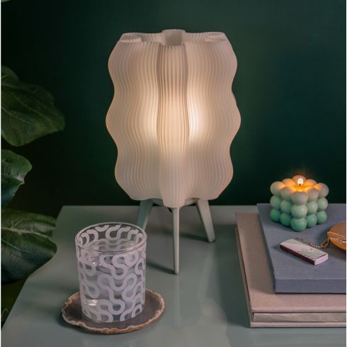 Wooj Design's Wavy Eco-Friendly Lamp on a nightstand