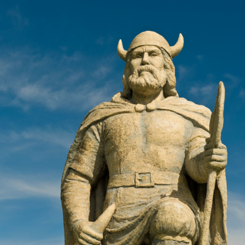 The Viking Statue in Gimli, Manitoba against a clear blue sky