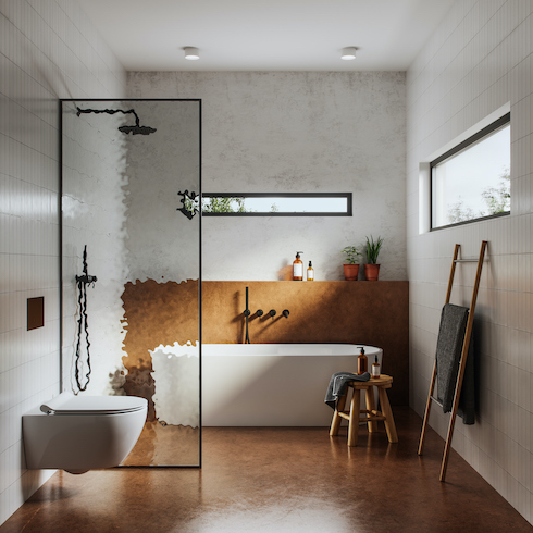 Modern bathroom interior with plaster walls, brown high shine floors, floating toilet, stand alone white bathtub in a shower wet room with black hardware shown in the HGTV Canada gallery Unusual Bathroom Renovation Ideas That Will Be Popular In 2025