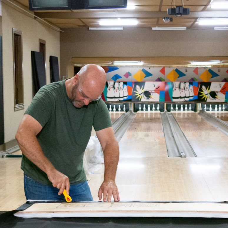 Bryan Baeumler working in Canada's oldest bowling alley