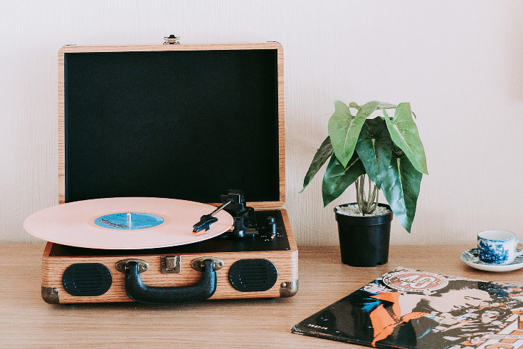 A record player and small houseplant