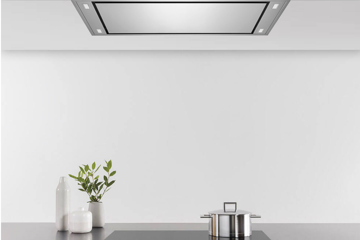 A gleaming white modern kitchen featuring the Victory Horizon model from Victory Range Hoods