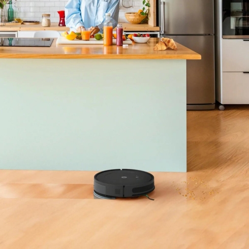 An iRobot cleaning the floors of a house