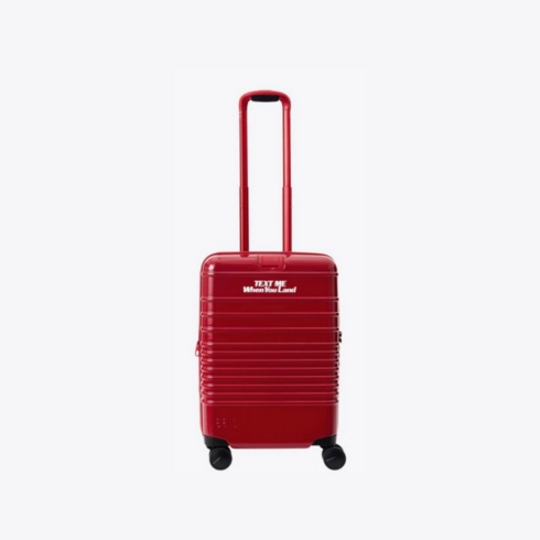 A red BEIS Lonely Ghost carry-on suitcase