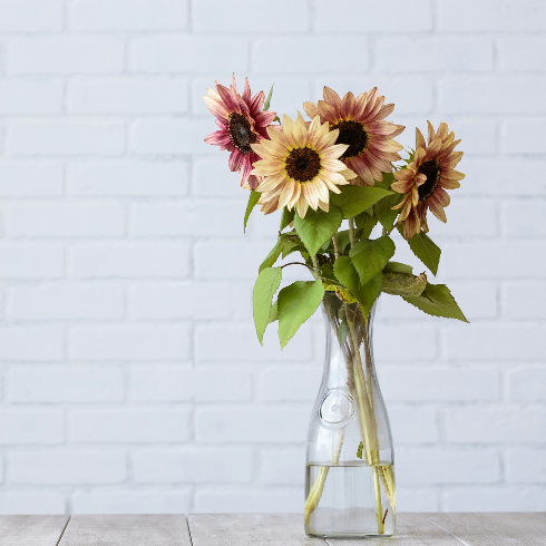 A vase with fresh sunflowers