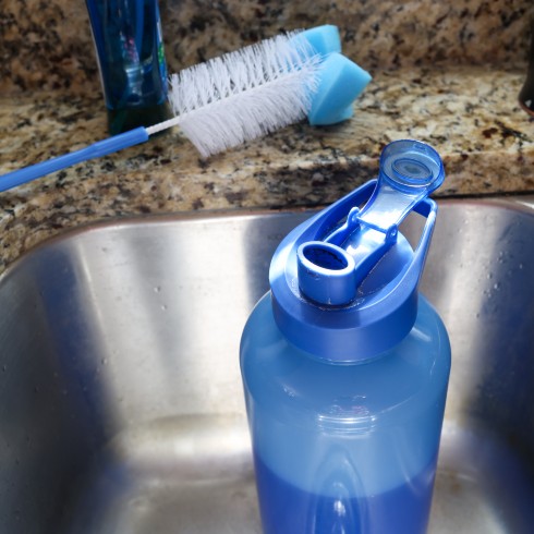 cleaning a water bottle