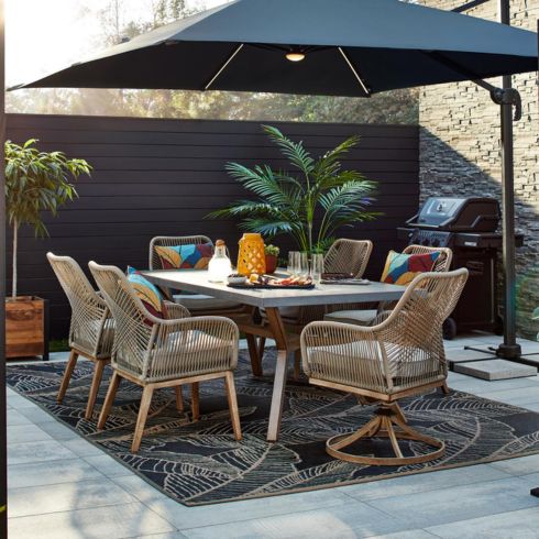 Outdoor patio set with rug and plants
