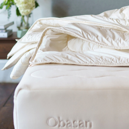A natural comforter made of wool by organic bedding brand Obasan