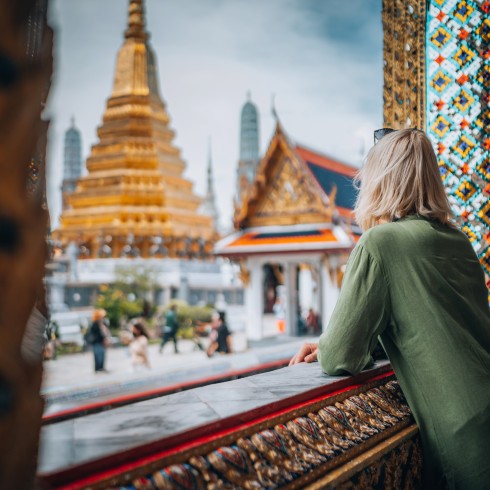 Person looking at Thai temples