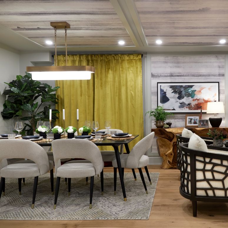 Modern dining space with a bright mustard curtain and grey accents