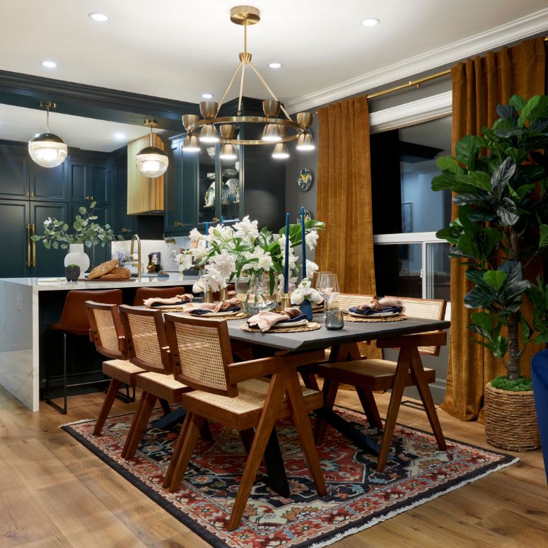 Dining room with wood table and wicker chairss