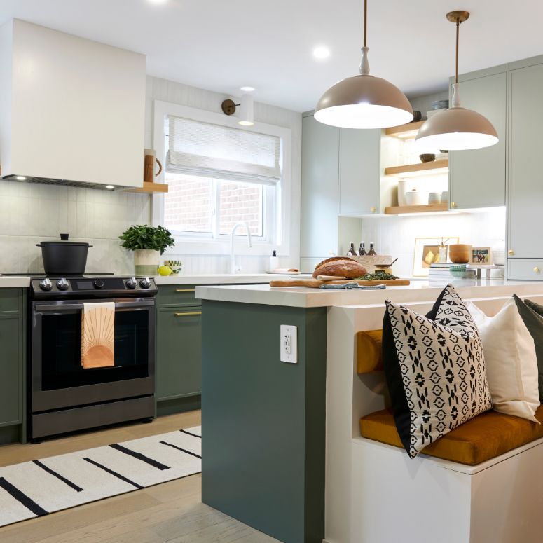 bright kitchen with with and green cabinets