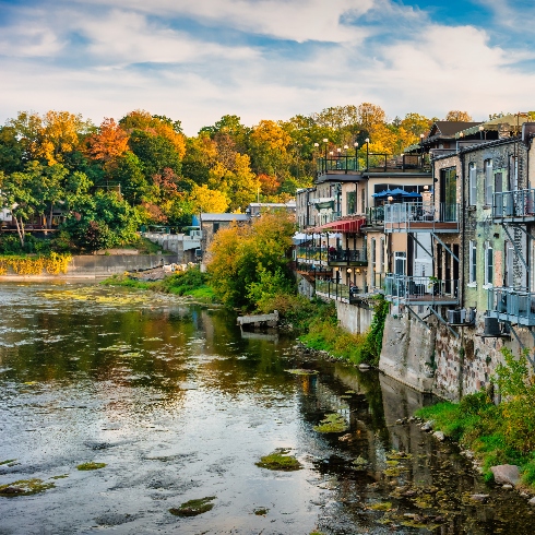 Buildings lining the Grand River in Paris, Ontario.