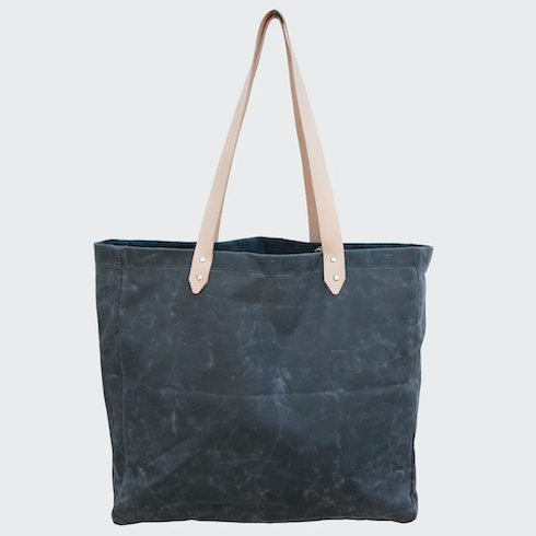 Waxed Canvas Beach Bag in Storm by Salt Shop on Salt Spring Island on a grey background as part of HGTV Canada's 10 Gift Ideas for the Men in Your Life